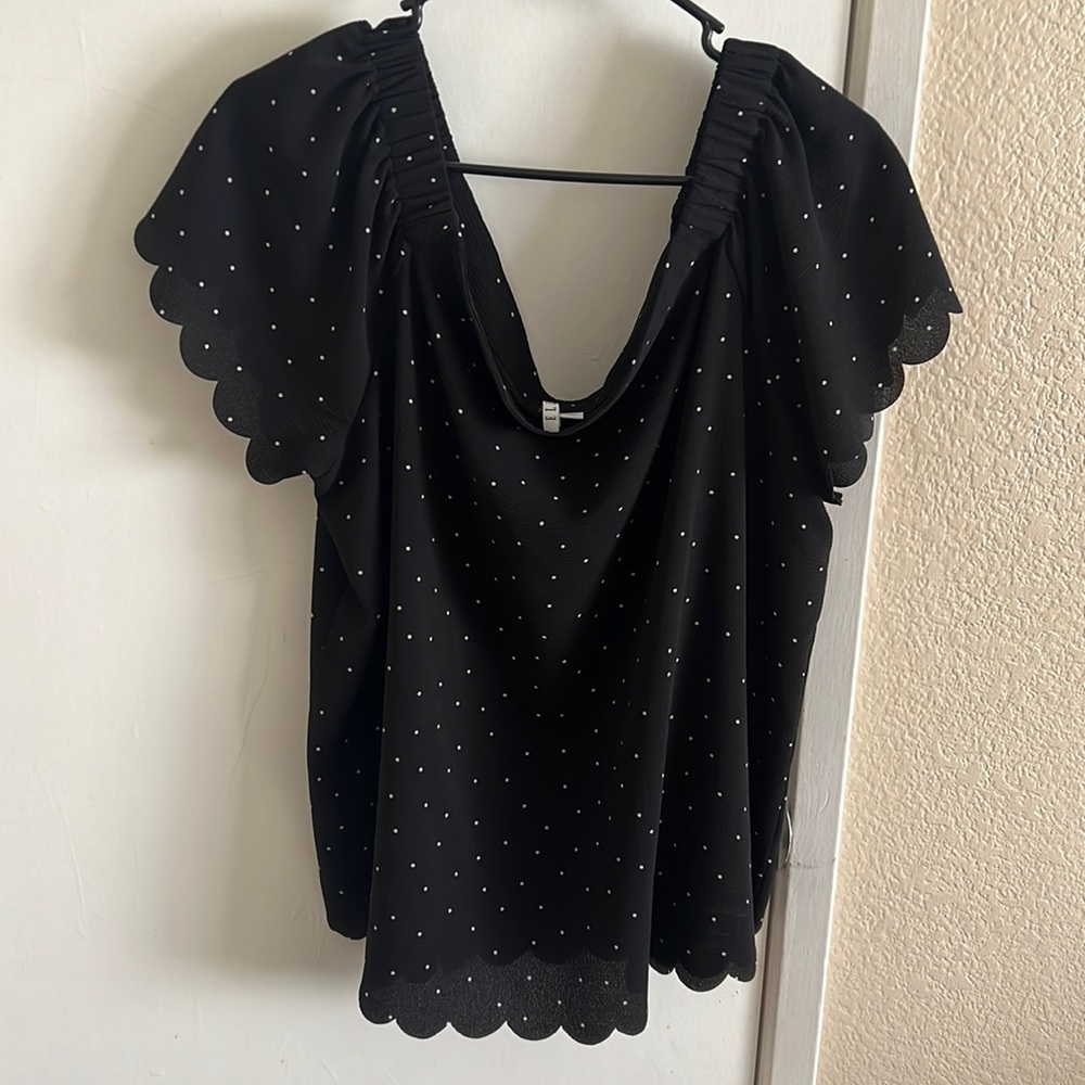Off the shoulder black polka dot shirt